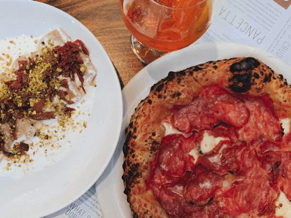 Pizza and pasta dish from Flour House in San Luis Obispo